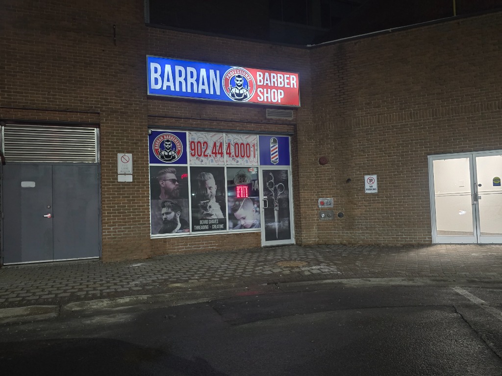Barran Barber Shop interior — leather chairs, warm lighting and premium grooming tools